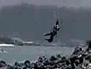 Kitesurfer gets brutally slammed into rocks.
