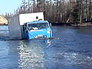 Insane truckdriver crosses heavy flooded streets