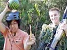 Watermelon shot off head with sniper rifle.