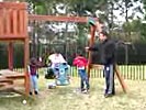 Dad owned by swingset at playground
