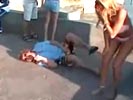 Hot bikini babe kicks unsuspected reporter in the nuts.