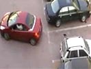 2 Women try to park in the same spot.