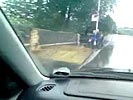 Schoolkids get brutally splashed by car driving through huge puddle.