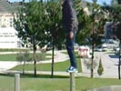 Kid destroys nuts on pole.