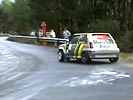 Rally car nearly lands on spectator.