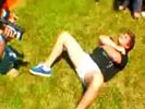 Dumb kid volunteers for a water melon getting dropped on his nuts from 30 ft up.