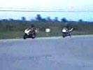 Biker collide brutally in drag race. WTF!