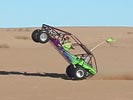 Kid pulls off an amazing sandrail wheelie. 