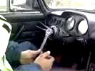 Moron steering his car with a wrench.