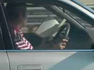 Reading a book while driving. Now that is not so smart. I wonder what book it was, must have been a really good one.