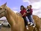 Horse throws 4 kids off his back.